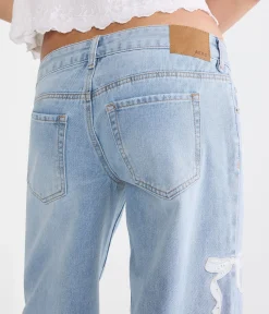 Super Low-Rise Ultra Wide Leg Eyelet Bow Jean